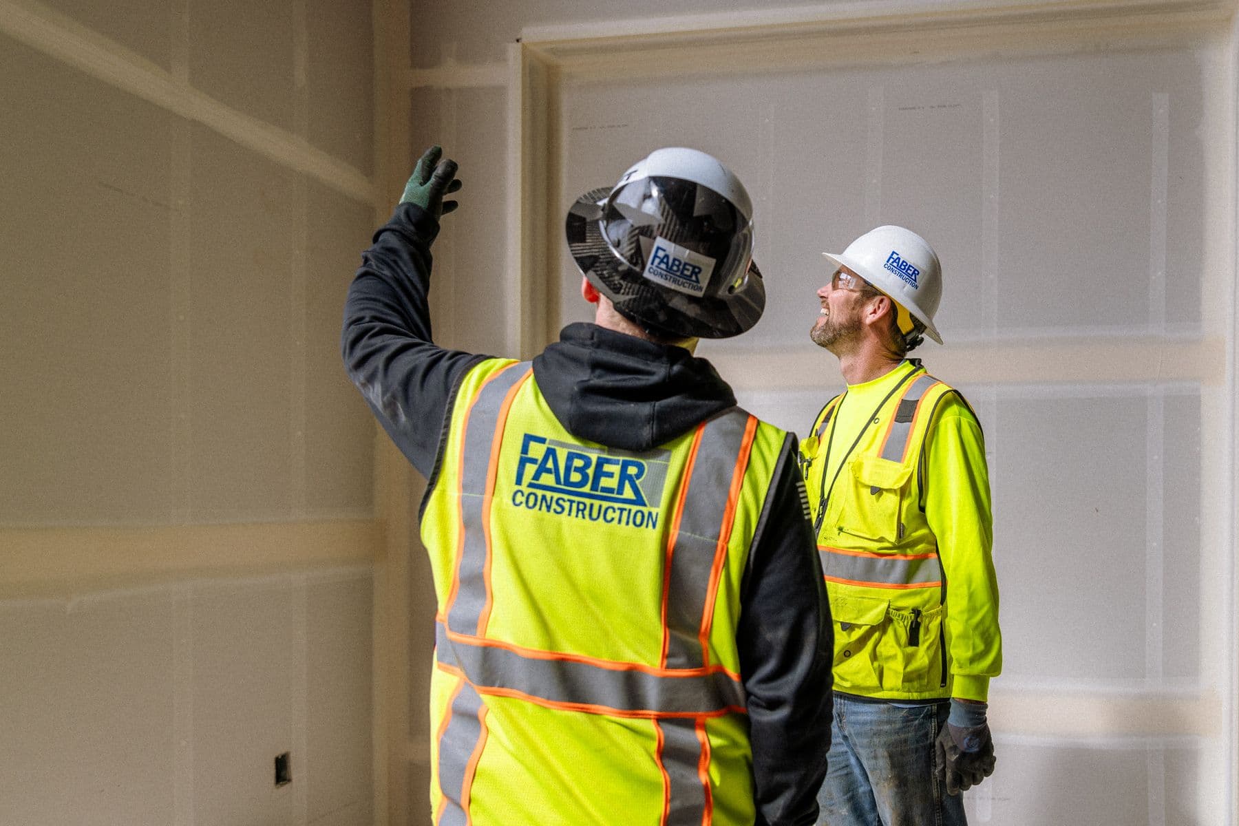 Two Faber team members inspecting interior finishing
